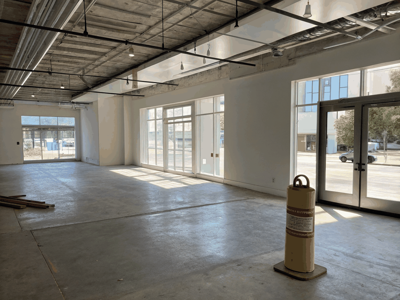 Retail shop fit-out with new track lighting and electrical conduit